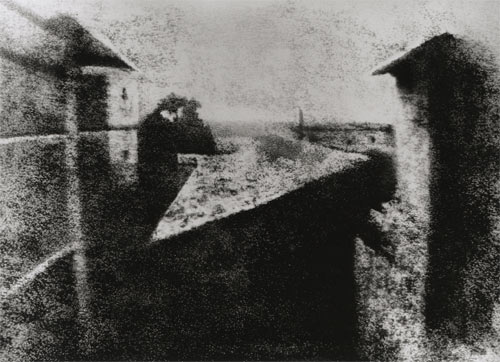Rediscovered in 1952 by photo historians Helmut and Alison Gernsheim, the “First Photograph” was first depicted in this well-known reproduction that was retouched by Helmut Gernsheim prior to its international release. Joseph Nicéphore Niépce's “View from the Window at Le Gras.” 1826 or 1827. Gernsheim Collection, Harry Ransom Center / The University of Texas at Austin.